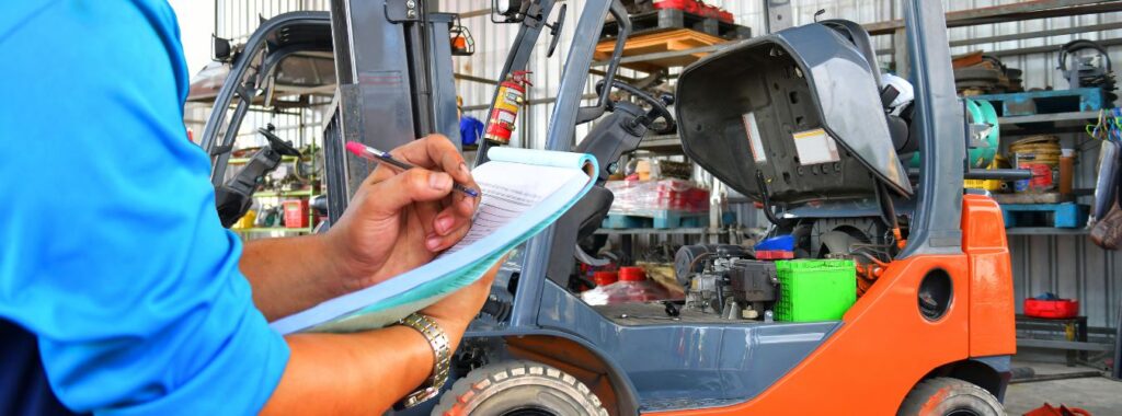 Forklift mast and chains being inspected during a thorough examination