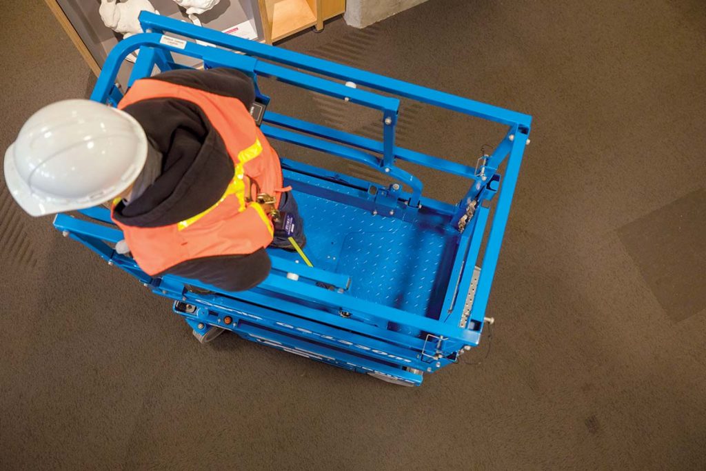 A scissor lift, which raises a larger platform vertically rather than reaching over obstructions