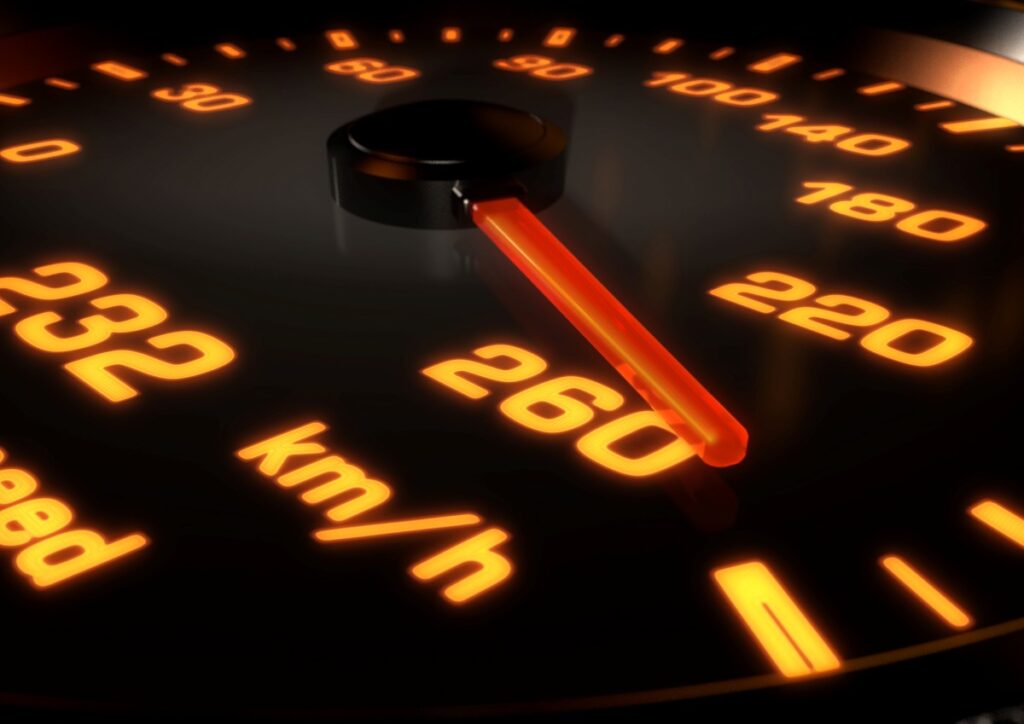 close up shot of speedometer with the needle pointing at 260 km/h depicting over speeding or reckless driving