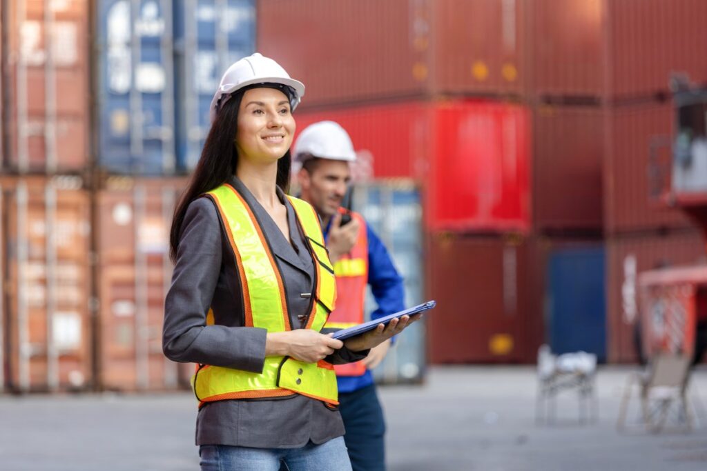 female employer supervising in warehouse