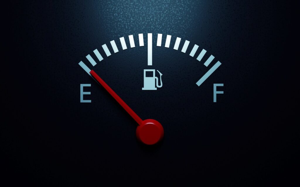 
Fuel gauge with the red needle pointing at E, indicating empty