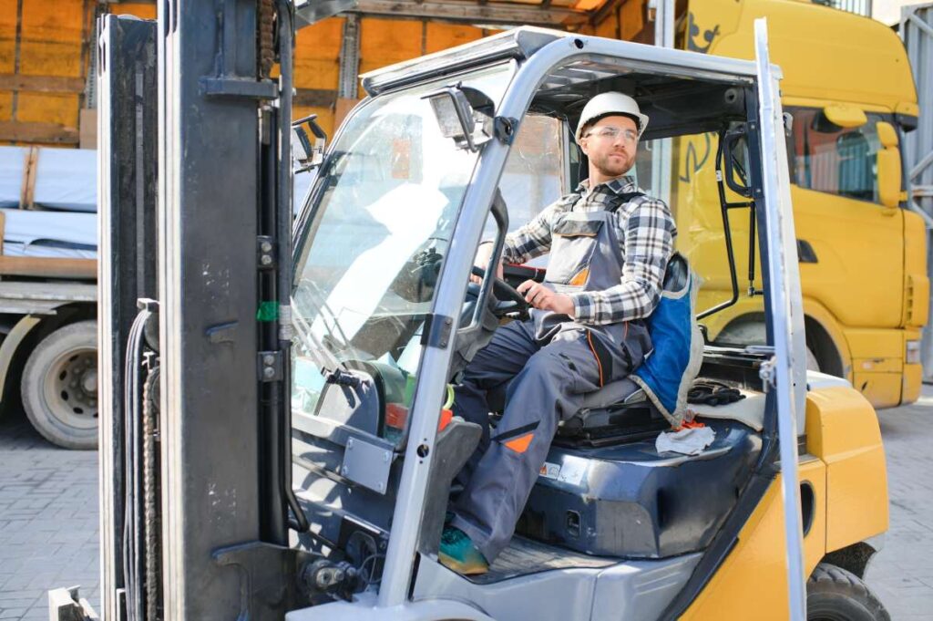 warehouse worker riding a forklift