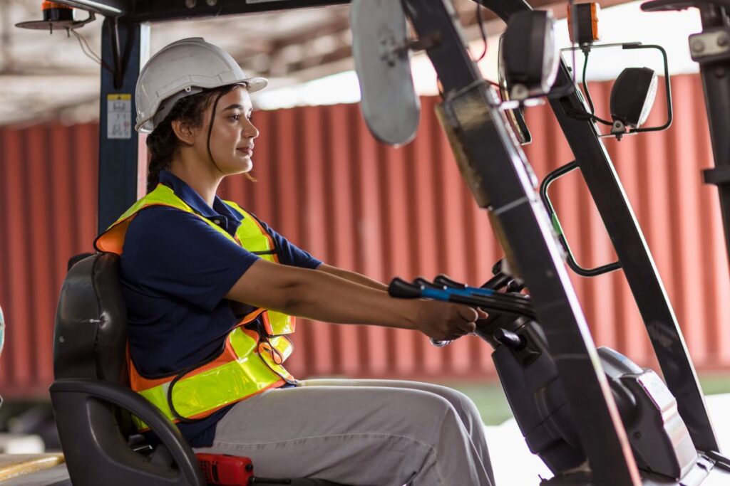 Certificated forklift operator at work, meeting the PUWER training duty