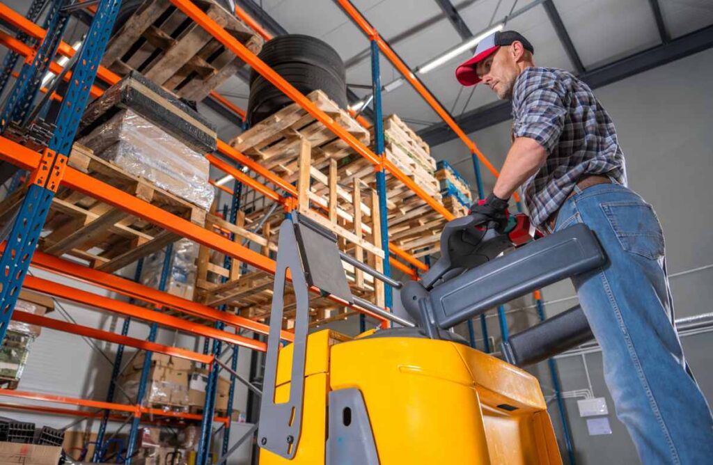 Warehouse Worker Operating Forklift