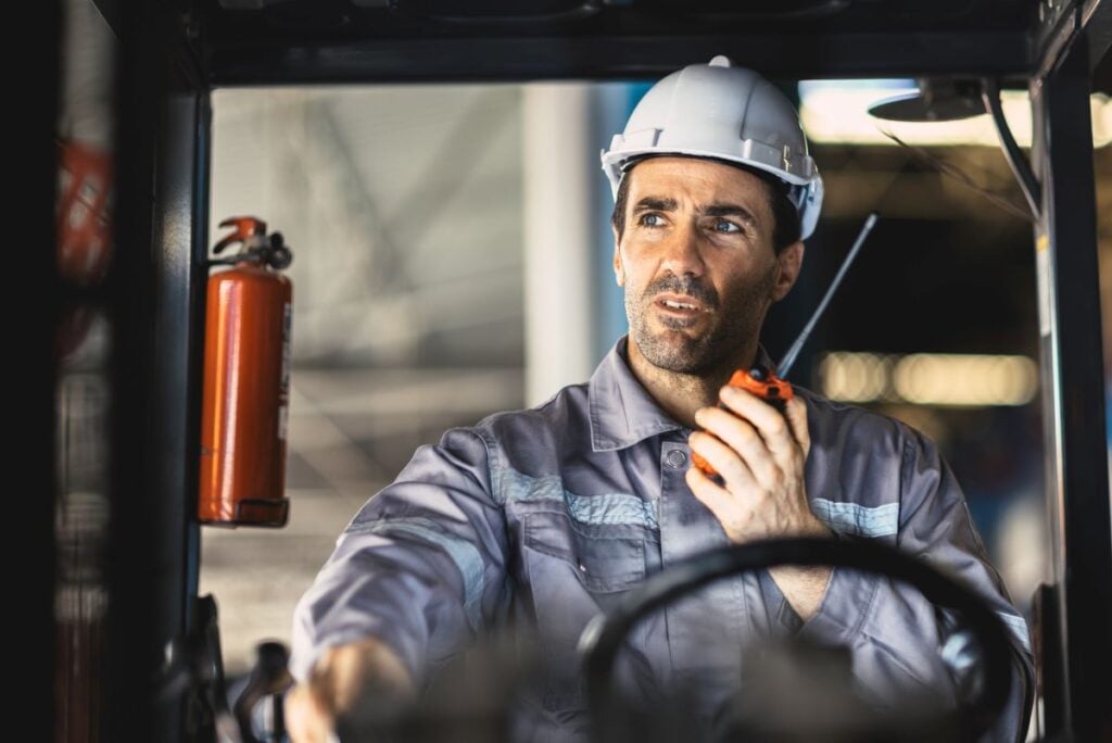 driver worker male working in plant factory using radio command order conversation with team