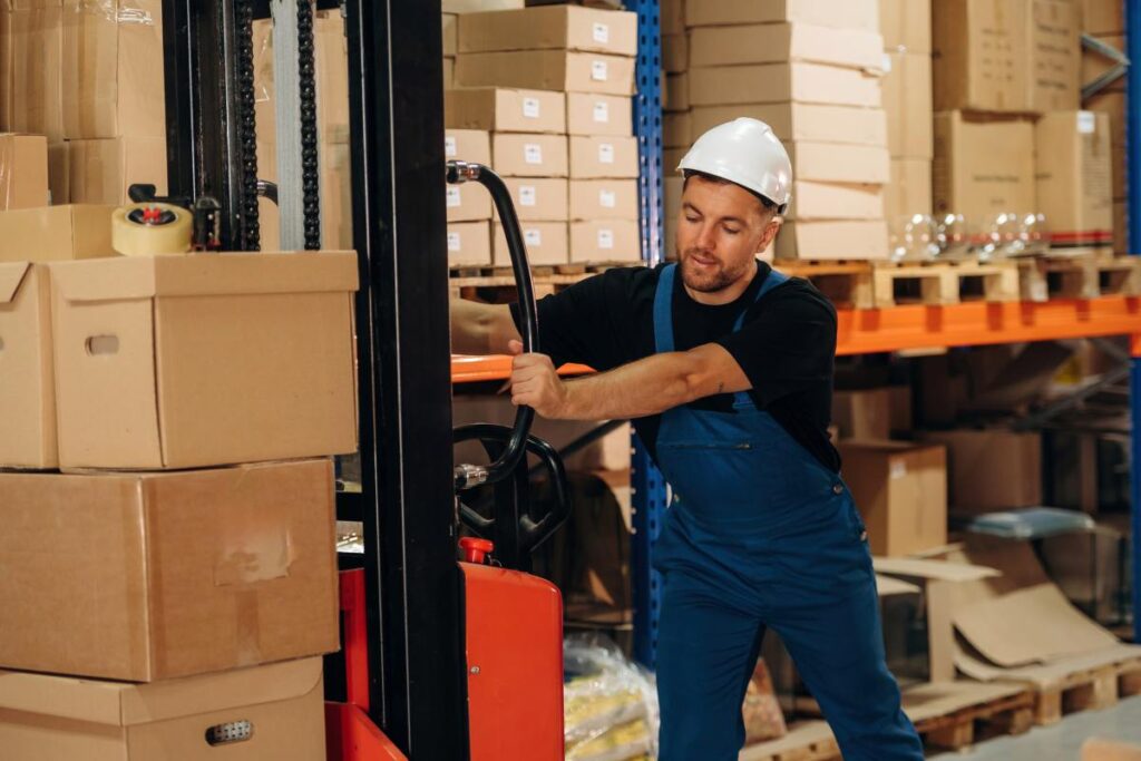 Warehouse Worker Operating Forklift in Storage Facility