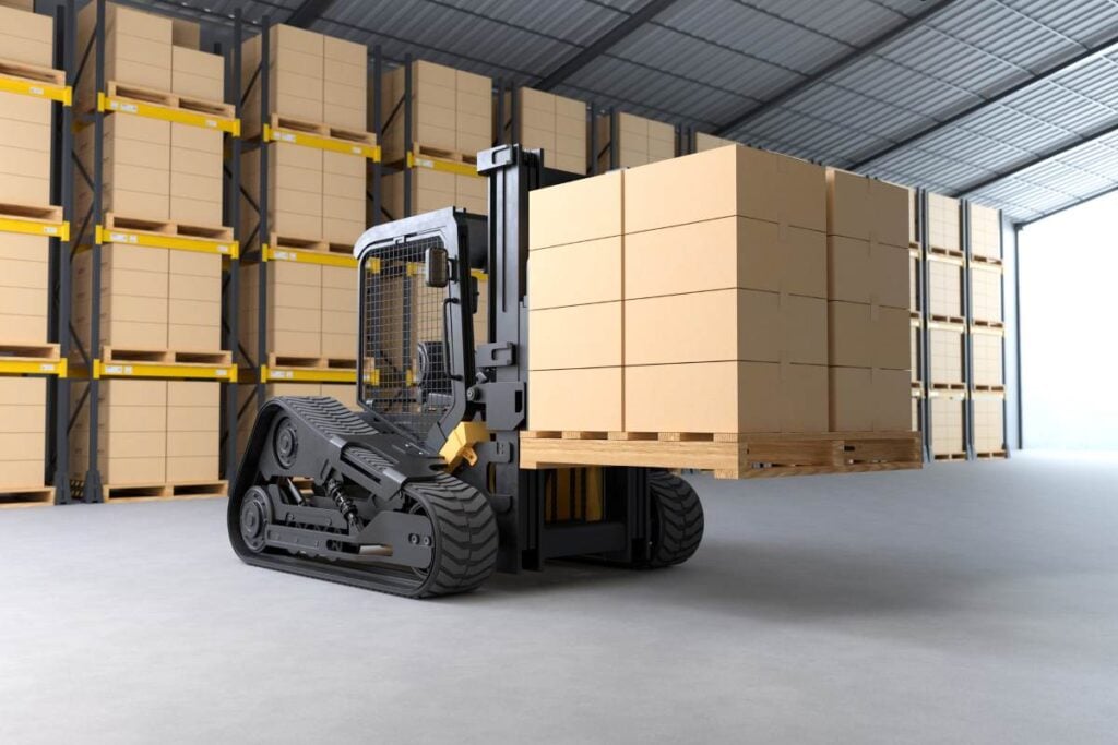 Forklift truck is lifting a pallet with cardboard boxes